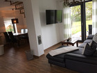 Ferienhaus Alter Apfelbaum - Wohnraum mit Couchecke und TV